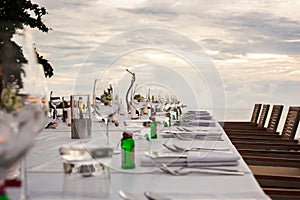 Long table wedding dinner setup.