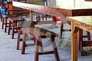 Long table and wooden benches in traditional Chinese restaurant