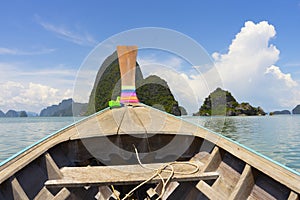 Long tail boat against blue sky in Phang Nga Bay