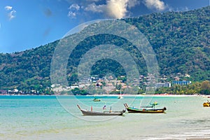 Long tail Boat on colourful sunset over Patong Beach Phuket Thailand