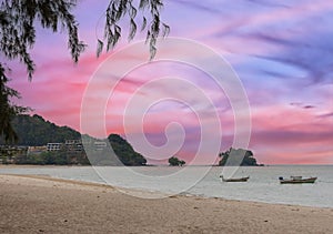 Long tail Boat on colourful sunset over Patong Beach Phuket Thailand