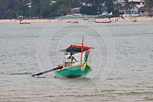 Long tail Boat on colourful sunset over Patong Beach Phuket Thailand