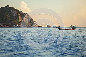 Long tail boat floating over blue sea at koh nang yuan and koh t