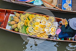 Long-tail boat with fruits on the floating market, Ha long bay, Vietnam