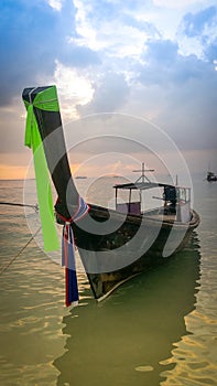 Long tail boat in sunset in Railay Beach, Thailand