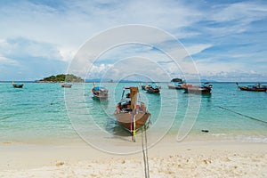 Long tail boats lined along the beach in Koh Lipe island in Thailand