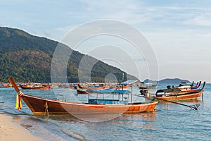 Long tail boats lined along the beach in Koh Lipe island in Thailand