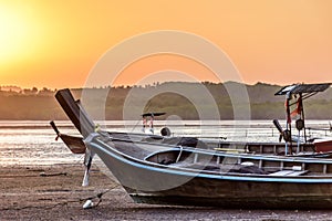 Long-tail boats at low tide at sunset, Phang-Nga Bay, Thailand