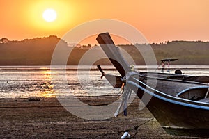 Long-tail boats at low tide at sunset, Phang-Nga Bay, Thailand