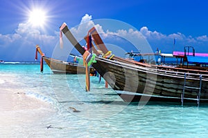 Long tail boats on white sand beach, Bamboo island, Phi Phi, And
