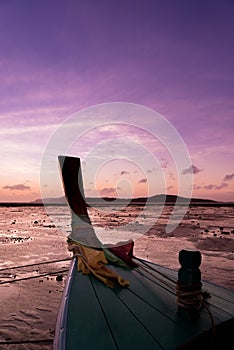 Long tail fishing boats at sunet