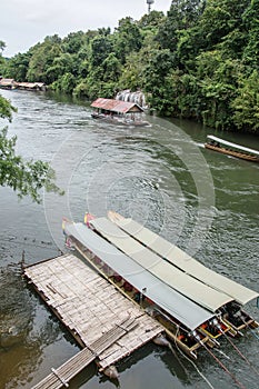 Long-tailed boat in river Kwai. Taken at Sai Yok Yai waterfall. Thailand.