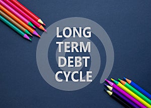 Long term debt cycle symbol. Concept words Long term debt cycle on beautiful black paper. Beautiful black background. Colored