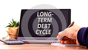 Long-term debt cycle symbol. Concept words Long-term debt cycle on beautiful black tablet. Beautiful white background. Businessman