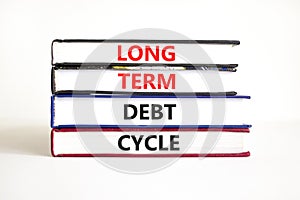 Long term debt cycle symbol. Concept words Long term debt cycle on beautiful books. Beautiful white table white background.