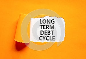 Long term debt cycle symbol. Concept words Long term debt cycle on beautiful white paper. Beautiful orange background. Business