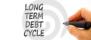 Long term debt cycle symbol. Concept words Long term debt cycle on beautiful white paper. Beautiful white background. Voter hand.