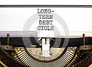Long-term debt cycle symbol. Concept words Long-term debt cycle typed on beautiful old retro typewriter. Beautiful white