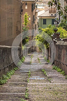 Long tight alley on the hills of Genoa city