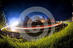 Long time exposure bulb shot of an 24h car race during night motorsport background