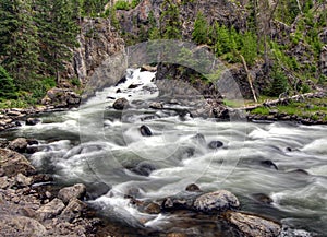 Long Time Exposure Of Flowing Water At Firehole River Yellowstone National Park