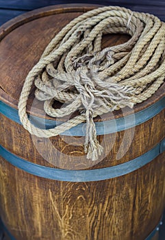 Long twisted rope lying on brown tun