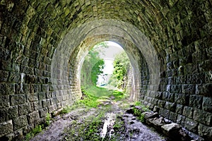 Long underground brick tunnel photo