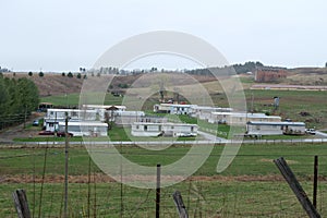 Long view of a Company/Factory in outer area of the town photo