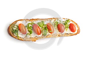 Long white bread sandwich with cream cheese, tomatoes and microgreen isolated on white. top view