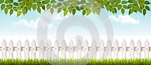 Long white fence banner with grass and fence.