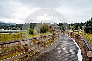 A long and wide wood walkway