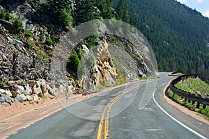 Long and Winding Curvy Mountain Road with Rock Slide Fencing