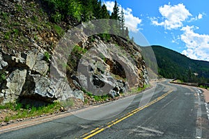 Long and Winding Curvy Mountain Road with Rock Slide Fencing