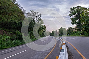 A long and winding road with nature along the way