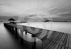 The long wooden bridge in black and white