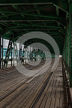 Long wooden and metal bridge with tram rails