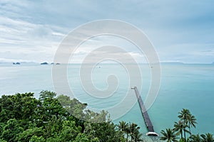 The long wooden pier with light cloud sky after the rain - Intercontinental Samui, Thailand