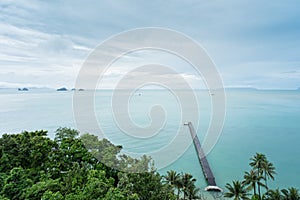 The long wooden pier with light cloud sky after the rain - Intercontinental Samui, Thailand photo