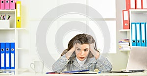 Long working day. tired woman work online on computer. confident office worker. secretary with document folder. formal