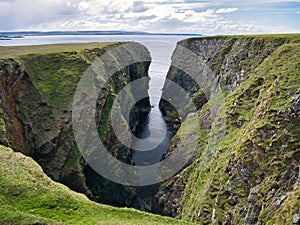 Longa Geo north of Collaster on Unst, Shetland, UK - the rock is of the Westing Gneiss Formation - Psammite, Gneissose