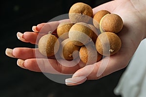 Longan, fresh longan on palms.