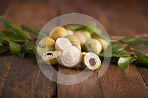 Longan fruit over wooden background