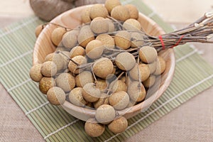 Longan on wood bowl