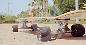 Longboard Resting on the Ground at the Street