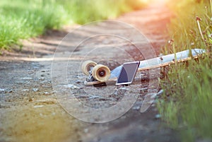 A longboard and a smartphone. popularization of skateboard movement in social media, subculture,