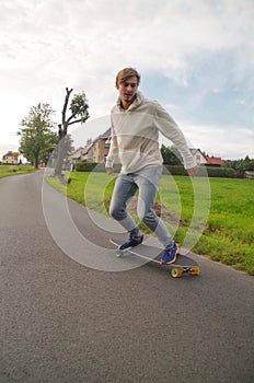 Longboarder going down the hill vertical