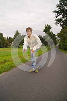 Longboarder going up the hill vertical shot