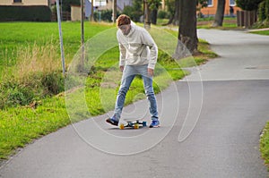 Longboarder on the street getting back onto board