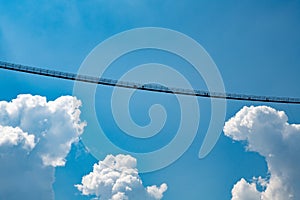 Longest Footbridge, blue sky and clouds, longest Tibet Style Swing Bridge in Austrian Alps, Highline 179, Austria 