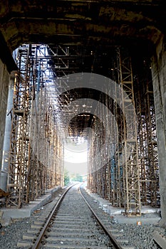 The longest railroad tracks going through under construction bridge